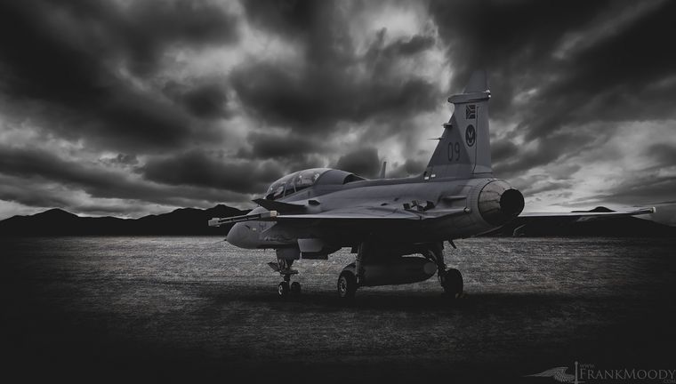 Gripen fighter jet under storm clouds, black and white photograph by Frank Moody