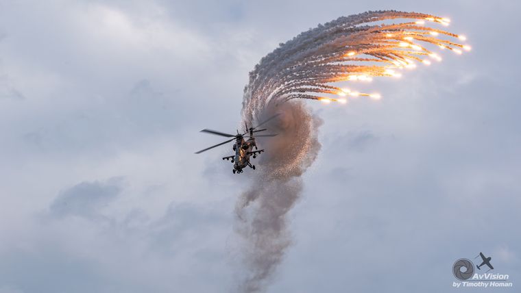 Rooivalk attack helicopter firing flares, photograph by Timothy Homan