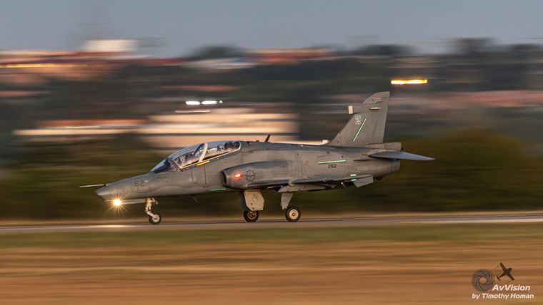 Hawk jet trainer rolling down the runway at dusk, photograph by Timothy Homan