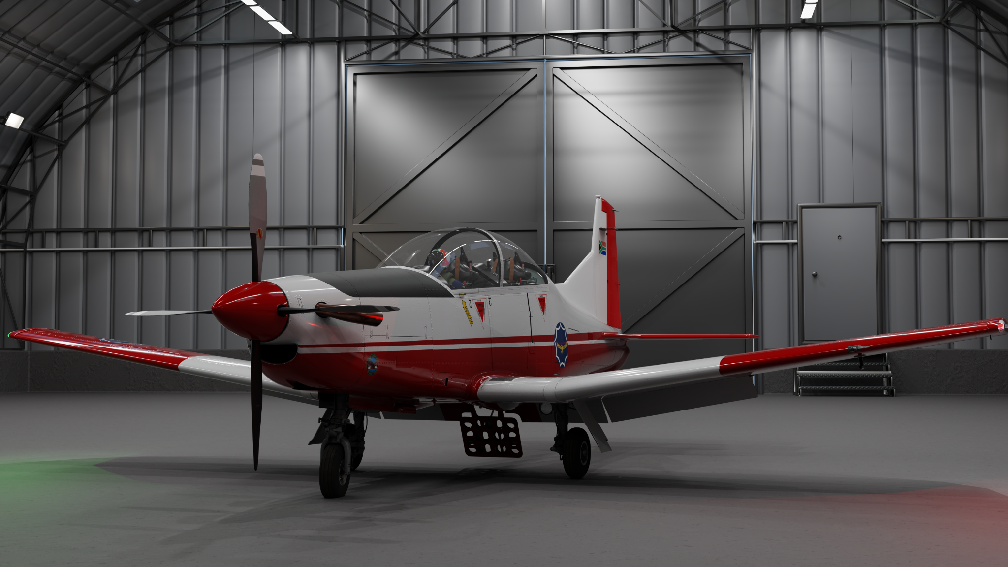TheAIR.Tech PC-7 MkII in a hangar